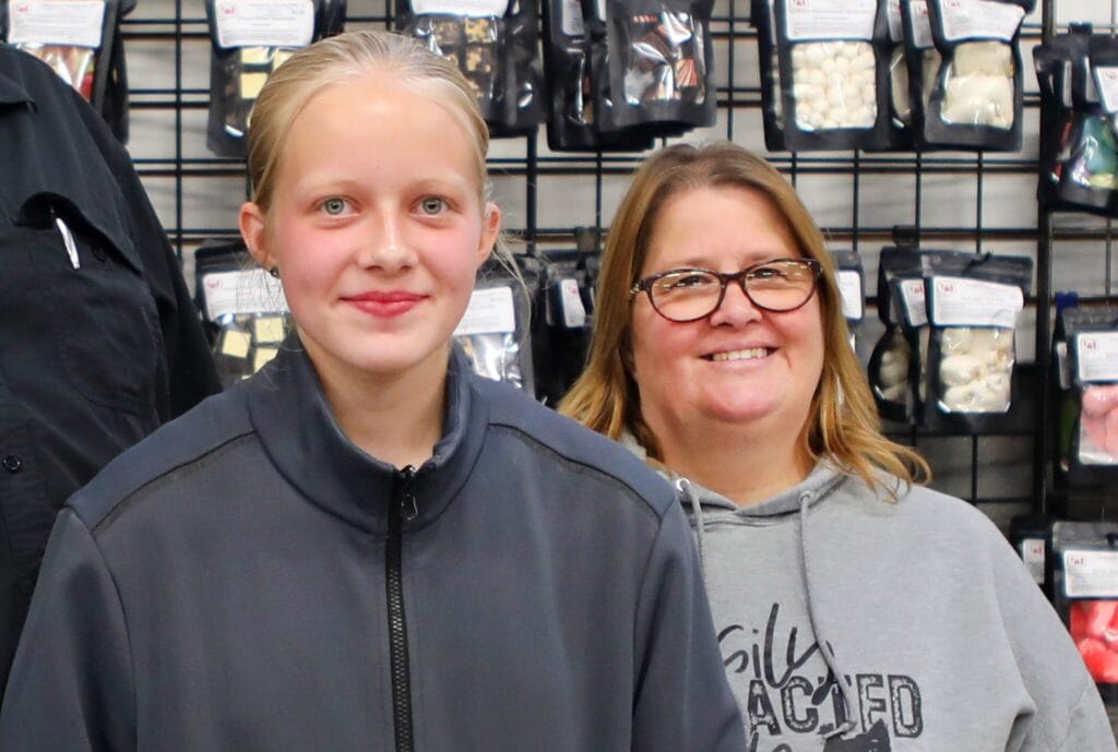 Woman and teen girl wearing gray hoodies