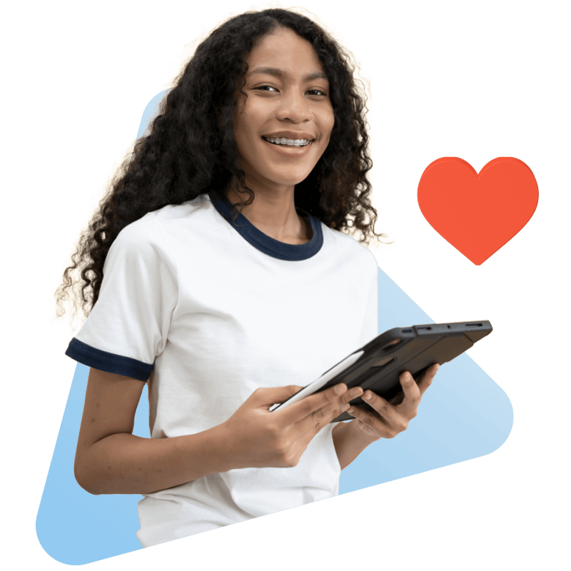 A woman smiles while holding a tablet displaying a heart symbol, symbolizing love and connection in a digital age.