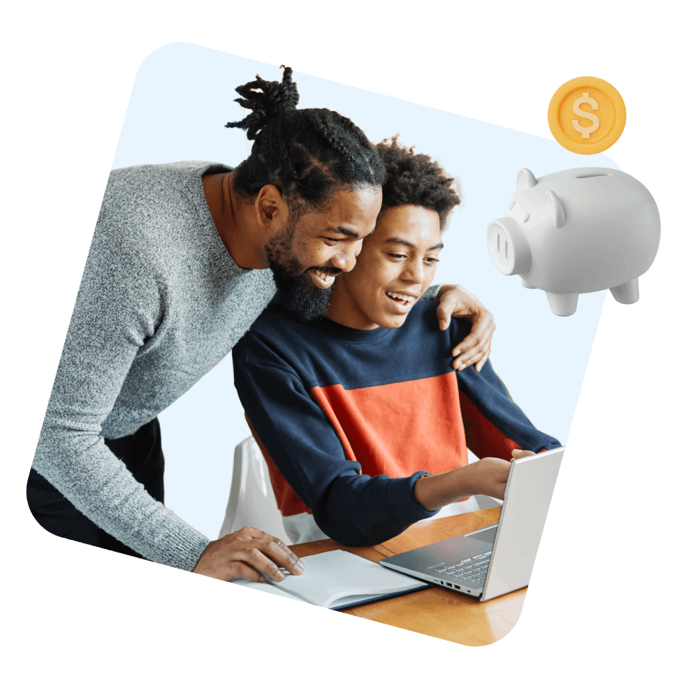 A man and a young boy are intently observing a laptop screen together, sharing a moment of curiosity and learning.