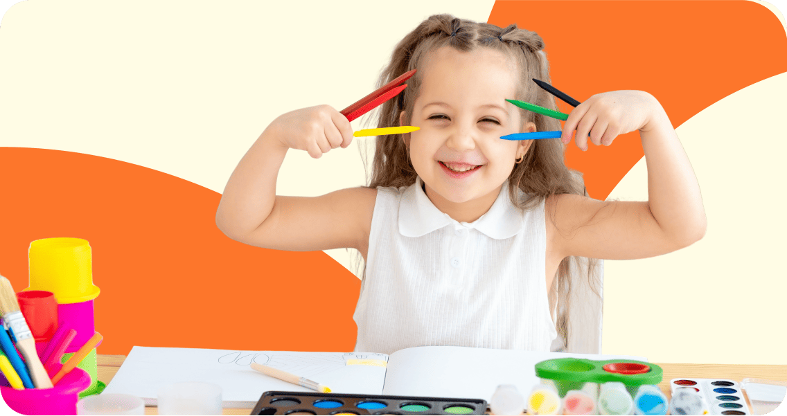 A young girl joyfully holds a vibrant set of colored pencils, ready to create her next masterpiece.