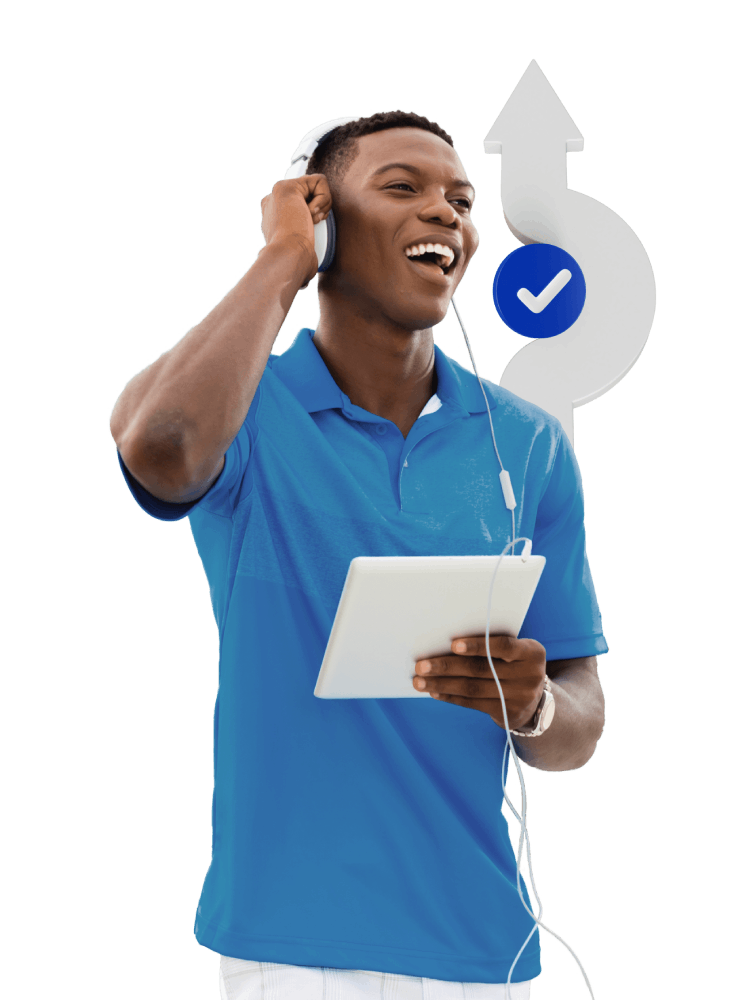 A man enjoying music while holding a tablet, immersed in his listening experience.