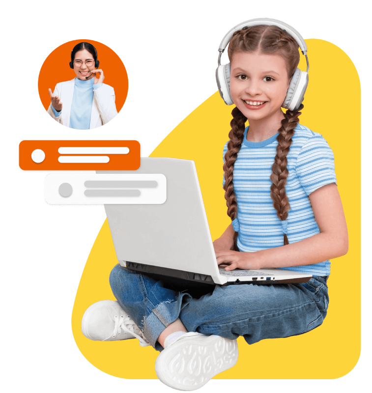 A girl wearing headphones is focused on her laptop, immersed in her work or entertainment.