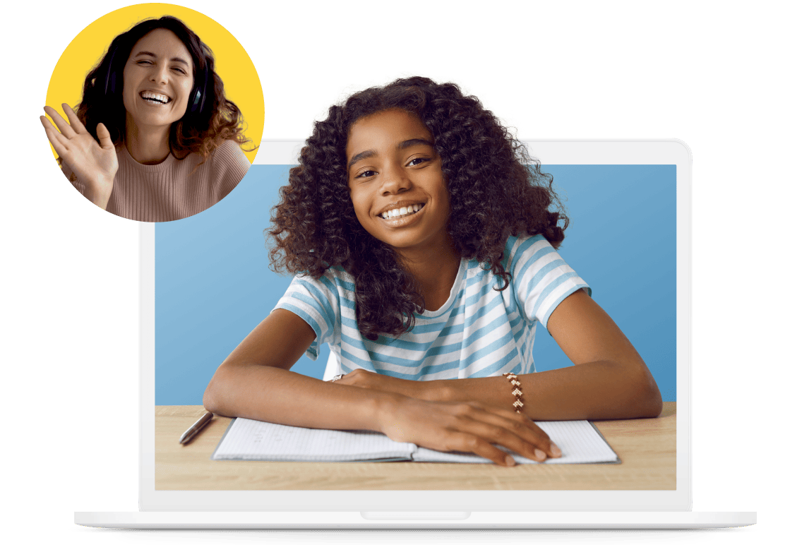 Two girls sitting together, each focused on their laptops, engaged in a collaborative work session.