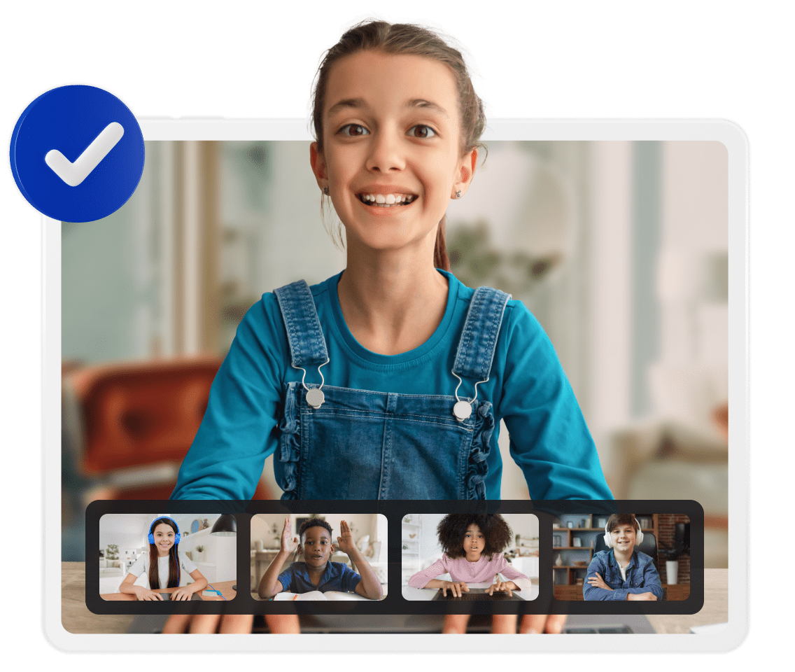 A girl smiles brightly while engaged in a video chat, showcasing a moment of joy and connection through technology.