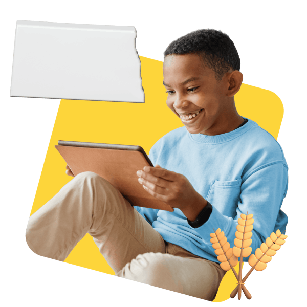 A boy in a blue shirt interacts with a tablet displaying a map of North Dakota