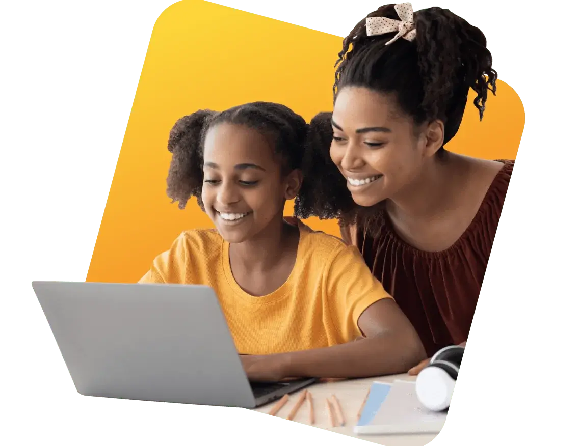A woman and a child engaged in using a laptop together, sharing a moment of learning and interaction.